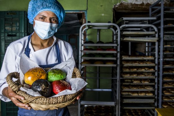 latin-baker-preparing-dough-baking-colored-brioche-breads-cookies